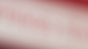 A view of a mangonada drink, in a restaurant interior setting.