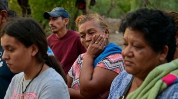 Relatives of the 10 miners trapped in a coal mine after a collapse more than a week, attend a press conference in the community of Agujita, Sabinas Municipality, Coahuila State, Mexico, on August 14, 2022. - The flooded mine where ten workers have been trapped for 11 days in northern Mexico registered an "abrupt increase in water levels," authorities reported on Sunday, which could complicate rescue efforts. (Photo by Pedro PARDO / AFP) (Photo by PEDRO PARDO/AFP via Getty Images)