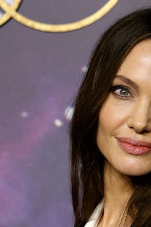 US actor Angelina Jolie poses on the blue carpet on arrival to attend the UK Gala Screening of the film 'Eternals', at the BFI IMAX in London on October 27, 2021. (Photo by Tolga Akmen / AFP) (Photo by TOLGA AKMEN/AFP via Getty Images)