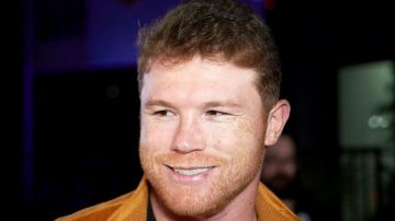 RIVERSIDE, CALIFORNIA - JULY 06: Saul Canelo Álvarez speak with press at the Professional Boxer Canelo Alvarez Hosts Exclusive Cars Dealership Grand Opening at Exclusive Cars on July 06, 2022 in Riverside, California. (Photo by Unique Nicole/Getty Images)