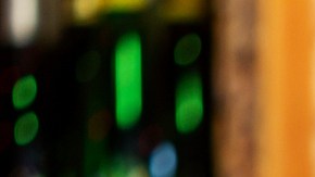 Assortment of alcoholic cocktails on a bar counter with gin and tonic, Moscow Mule, Asperol Spritz, Long Island Ice Tea, Sekt, Lillet Wild berry with fresh fruit ingredients in the foreground
