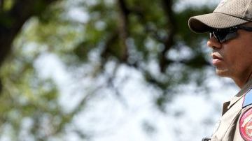 A police officer stands guard outside Robb Elementary School in the town of Uvalde, Texas, the United States, May 27, 2022. At least 19 children and two adults were killed in a shooting at Robb Elementary School in the town of Uvalde, Texas, on Tuesday. (Photo by Wu Xiaoling/Xinhua via Getty Images)