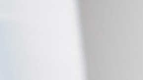 Relax, happy and woman on social media with smartphone reading funny meme online on weekend. Puerto Rico girl enjoying wifi internet app communication while resting on sofa in living room.