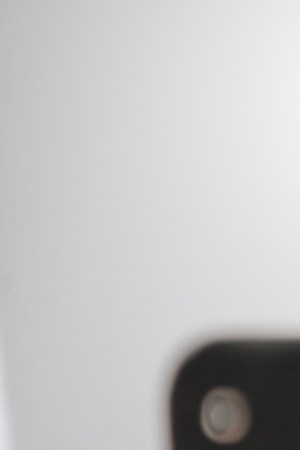 Relax, happy and woman on social media with smartphone reading funny meme online on weekend. Puerto Rico girl enjoying wifi internet app communication while resting on sofa in living room.