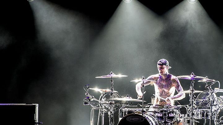 LONDON, UNITED KINGDOM - AUGUST 06: Travis Barker of Blink 182 performs on stage during their Reading Leeds Festival warmup show at Brixton Academy on August 6, 2014 in London, United Kingdom. (Photo by Ollie Millington/Redferns via Getty Images)