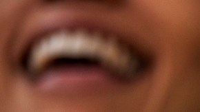 Front view portrait of Mexican football wearing Lucha Libre wrestling mask while watching international championship match at stadium