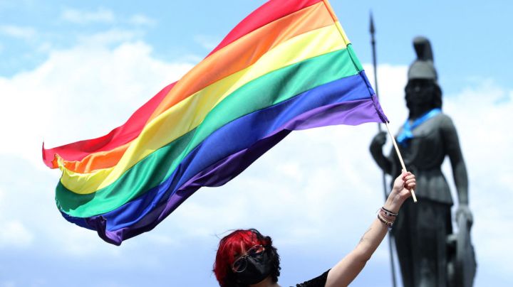 A person waves the rainbow flag, or pride flag, during the first in-person LGBT+ Pride march amid the novel coronavirus COVID-19 pandemic, in Guadalajara, Jalisco State, Mexico, on June 12, 2021. (Photo by Ulises RUIZ / AFP) (Photo by ULISES RUIZ/AFP via Getty Images)
