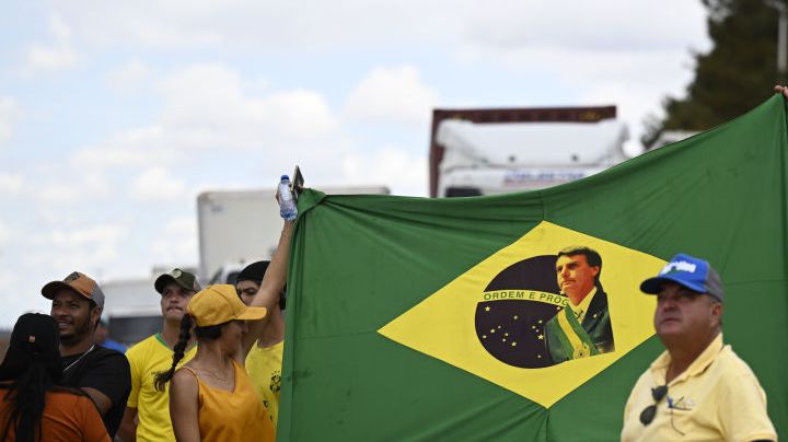 BRASILIA, BRAZIL - NOV 01 - Supporters of Brazil's President Jair Bolsonaro react, as they block highway BR-251 during a protest against President-elect Luiz Inacio Lula da Silva who won a third term following the presidential election run-off, in Planaltina, Brazil, November 1, 2022. (Photo by Mateus Bonomi/Anadolu Agency via Getty Images)