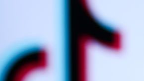 TikTok logo displayed on a phone screen and TikTok logo displayed on a laptop screen are seen in this illustration photo taken in Krakow, Poland on November 5, 2022. (Photo by Jakub Porzycki/NurPhoto via Getty Images)