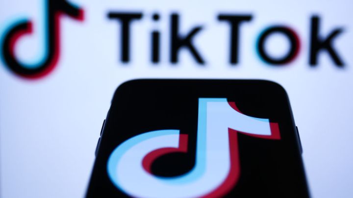 TikTok logo displayed on a phone screen and TikTok logo displayed on a laptop screen are seen in this illustration photo taken in Krakow, Poland on November 5, 2022. (Photo by Jakub Porzycki/NurPhoto via Getty Images)