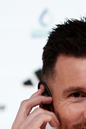 DOHA, QATAR - NOVEMBER 21: Lionel Messi of Argentina reacts during the Argentina match day -1 Press Conference at Main Media Center on November 21, 2022 in Doha, Qatar. (Photo by Mohamed Farag/Getty Images)