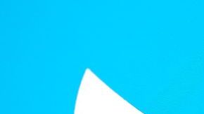 This illustration photo taken May 13, 2022, displays Elon Musks Twitter account with a Twitter logo in the background in Los Angeles. - Elon Musk sent mixed messages Friday about his proposed Twitter acquisition, pressuring shares of the microblogging platform amid skepticism on whether the deal will close. In an early morning tweet, Musk said the $44 billion takeover was "temporarily on hold," pending questions over the social media company's estimates of the number of fake accounts or "bots." That sent Twitter's stock plunging 25 percent. (Photo by Chris DELMAS / AFP) (Photo by CHRIS DELMAS/AFP via Getty Images)