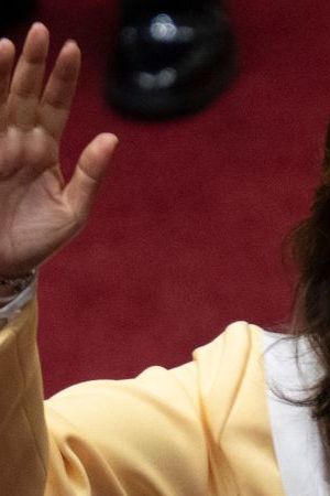 Peruvian Dina Boluarte greets members of the Congress after being sworn in as the new President hours after former President Pedro Castillo was impeached in Lima, on December 7, 2022. - Peru's Pedro Castillo was impeached and replaced as president by his deputy on Wednesday in a dizzying series of events in the country that has long been prone to political upheaval. Dina Boluarte, a 60-year-old lawyer, was sworn in as Peru's first female president just hours after Castillo tried to wrest control of the legislature in a move criticised as an attempted coup. (Photo by Cris BOURONCLE / AFP) (Photo by CRIS BOURONCLE/AFP via Getty Images)