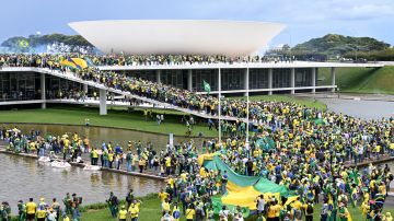 Supporters of Brazilian former President Jair Bolsonaro hold a demonstration at the Esplanada dos Ministerios in Brasilia on January 8, 2023. - Brazilian police used tear gas Sunday to repel hundreds of supporters of far-right ex-president Jair Bolsonaro after they stormed onto Congress grounds one week after President Luis Inacio Lula da Silva's inauguration, an AFP photographer witnessed. (Photo by EVARISTO SA / AFP) (Photo by EVARISTO SA/AFP via Getty Images)