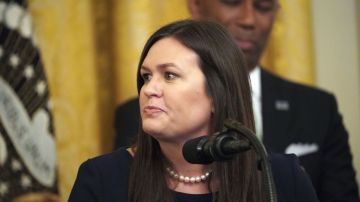 Sarah Sanders speaks as US President Donald Trump holds an event about second chance hiring and criminal justice reform in the East Room of the White House in Washington, DC, June 13, 2019. - President Donald Trump on Thursday made the surprise announcement of the departure of spokeswoman Sarah Sanders, who has been widely criticized for her performance in the White House. "After 3 1/2 years, our wonderful Sarah Huckabee Sanders will be leaving the White House at the end of the month and going home to the Great State of Arkansas," Trump tweeted, adding that he hoped she would run for governor of her state. (Photo by MANDEL NGAN / AFP) (Photo credit should read MANDEL NGAN/AFP via Getty Images)