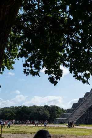 YUCATAN, MEXICO - DECEMBER 08: Tourists visit Temple of Kukulcan in Chichen Itza archeological site, in Yucatan, Mexico on December 8, 2022. The temple which is known as El Templo is allowed to visit around itself, however no longer climb them or enter the chambers. (Photo by Wolfgang Schwan/Anadolu Agency via Getty Images)