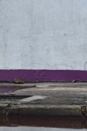 A member of the Mexican K-9 unit and his sniffer dog walk near a flattened building in Mexico City on September 22, 2017 three days after a strong quake hit central Mexico. A powerful 7.1 earthquake shook Mexico City on Tuesday, causing panic among the megalopolis' 20 million inhabitants on the 32nd anniversary of a devastating 1985 quake. / AFP PHOTO / Yuri CORTEZ (Photo credit should read YURI CORTEZ/AFP via Getty Images)