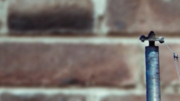 Mexican and American flag with wall behind
