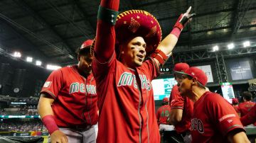 PHOENIX, AZ - MARCH 12: Joey Meneses #32 of Team Mexico is greeted in the dugout after hitting a two-un home run in the first inning during Game 4 of Pool C between Team Mexico and Team USA at Chase Field on Sunday, March 12, 2023 in Phoenix, Arizona. (Photo by Daniel Shirey/WBCI/MLB Photos via Getty Images)
