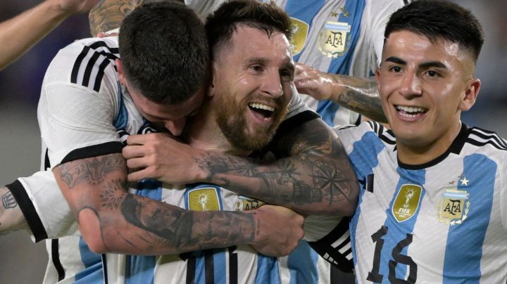 Argentina's forward Lionel Messi (C) celebrates with Argentina's midfielder Rodrigo De Paul (L) and Argentina's midfielder Thiago Almada after scoring a goal during the friendly football match between Argentina and Panama at the Monumental stadium in Buenos Aires, on March 23, 2023. - Lionel Messi capped a night of unbridled joy with the 800th goal of his career as world champions Argentina celebrated their homecoming with a 2-0 friendly victory over stubborn Panama in Buenos Aires on Thursday. (Photo by JUAN MABROMATA / AFP) (Photo by JUAN MABROMATA/AFP via Getty Images)