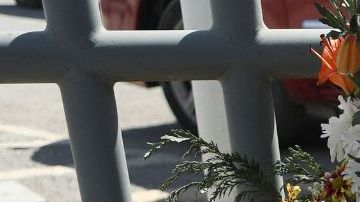 An activist lays a floral offering on a makeshift altar during a protest outside an immigration detention center in Ciudad Juarez, Chihuahua state, Mexico, on March 28, 2023. (Photo by HERIKA MARTINEZ / AFP) (Photo by HERIKA MARTINEZ/AFP via Getty Images)