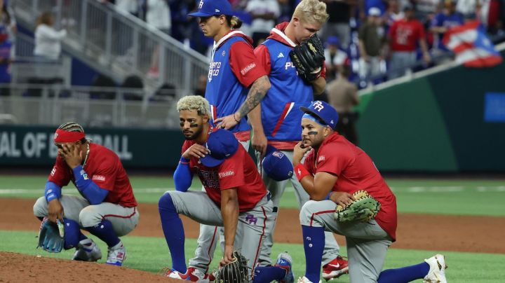 MIAMI, FLORIDA - MARCH 15: Members of Team Puerto Rico look on after Edwin Diaz #39 of Team Puerto Rico leaves the field in a wheelchair after sustaining an injury while celebrating a 5-2 win against Team Dominican Republic during their World Baseball Classic Pool D game at loanDepot park on March 15, 2023 in Miami, Florida. (Photo by Al Bello/Getty Images)