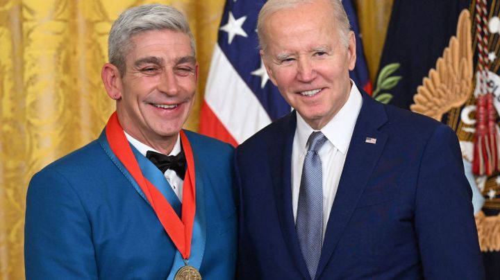 US President Joe Biden awards poet Richard Blanco with the 2021 National Humanities Medal during a ceremony in the East Room of the White House in Washington, DC, March 21, 2023. (Photo by SAUL LOEB / AFP) (Photo by SAUL LOEB/AFP via Getty Images)