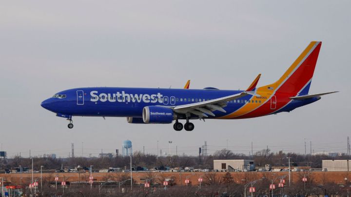 A Southwest Airlines passenger jet lands at Chicago Midway International Airport in Chicago, Illinois, on December 28, 2022. - The perfect storm of fierce snow squalls, howling wind and sub-zero temperatures forced the cancellation of thousands of flights in recent days, including around 5,900 on Tuesday and Wednesday, according to tracking site FlightAware.com. Most of the cancellations on December 27-28 were at Southwest Airlines, which pulled more than 60 percent of its flights due to cascading logistics issues. (Photo by KAMIL KRZACZYNSKI / AFP) (Photo by KAMIL KRZACZYNSKI/AFP via Getty Images)