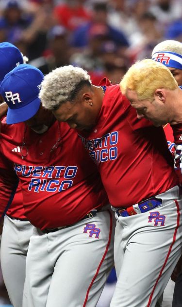 MIAMI, FLORIDA - MARCH 15: Edwin Diaz #39 of Team Puerto Rico is carried off the field after sustaining an injury while celebrating a 5-2 win against Team Dominican Republic during their World Baseball Classic Pool D game at loanDepot park on March 15, 2023 in Miami, Florida. (Photo by Al Bello/Getty Images)