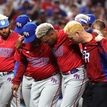 MIAMI, FLORIDA - MARCH 15: Edwin Diaz #39 of Team Puerto Rico is carried off the field after sustaining an injury while celebrating a 5-2 win against Team Dominican Republic during their World Baseball Classic Pool D game at loanDepot park on March 15, 2023 in Miami, Florida. (Photo by Al Bello/Getty Images)