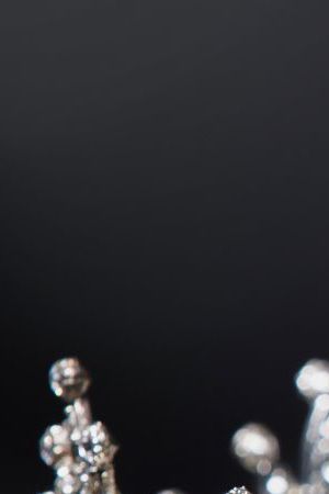 Diamond Silver Crown for Miss Pageant Beauty Contest, Crystal Tiara jewelry decorated gems stone and abstract dark background on black velvet fabric cloth, Macro photography copy space for text logo