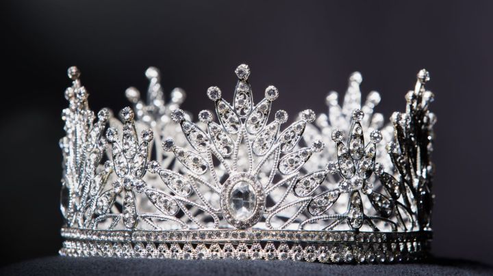 Diamond Silver Crown for Miss Pageant Beauty Contest, Crystal Tiara jewelry decorated gems stone and abstract dark background on black velvet fabric cloth, Macro photography copy space for text logo