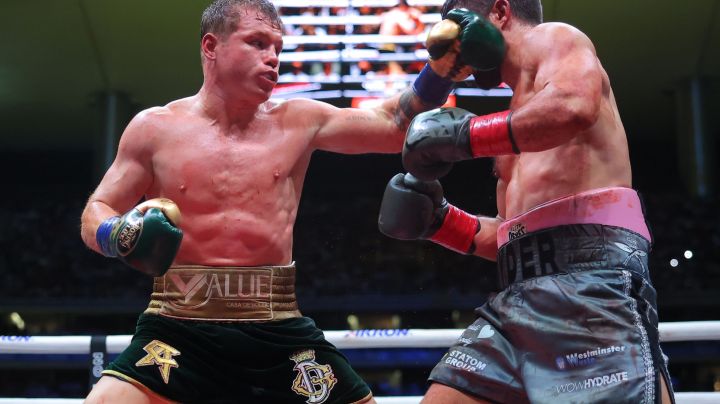 ZAPOPAN, MEXICO - MAY 06: Canelo Alvarez of Mexico punches John Ryder of Great Britain during the fight for the Super Middleweight Championship at Akron Stadium on May 06, 2023 in Zapopan, Mexico. (Photo by Hector Vivas/Getty Images)