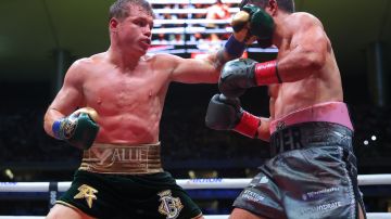 ZAPOPAN, MEXICO - MAY 06: Canelo Alvarez of Mexico punches John Ryder of Great Britain during the fight for the Super Middleweight Championship at Akron Stadium on May 06, 2023 in Zapopan, Mexico. (Photo by Hector Vivas/Getty Images)