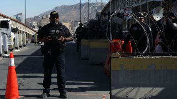 US Customs and Border Protection agents guard the Paso del Norte - Santa Fe International Bridge in Ciudad Juarez, Chihuahua state, Mexico that connects to El Paso, Texas on May 12, 2023. The United States bolted tough new immigration policies into place Friday, setting up an uncertain future for desperate migrants reaching its southern border as a top official expressed confidence the system will hold. Tens of thousands of people were expected to try to cross into the United States in coming days after it lifted pandemic-era rules, hoping to escape the poverty and criminal gangs wracking their own countries in what the United Nations called an "unprecedented displacement crisis". (Photo by HERIKA MARTINEZ / AFP) (Photo by HERIKA MARTINEZ/AFP via Getty Images)