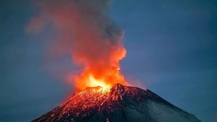 Incandescent materials, ash and smoke are spewed from the Popocatepetl volcano as seen from thr Santiago Xalitzintla community, state of Puebla, Mexico, on May 22, 2023. Mexican authorities on May 21 raised the warning level for the Popocatepetl volcano to one step below red alert, as smoke, ash and molten rock spewed into the sky posing risks to aviation and far-flung communities below. Sunday's increased alert level -- to "yellow phase three" -- comes a day after two Mexico City airports temporarily halted operations due to falling ash. (Photo by Erik GOMEZ TOCHIMANI / AFP) (Photo by ERIK GOMEZ TOCHIMANI/AFP via Getty Images)