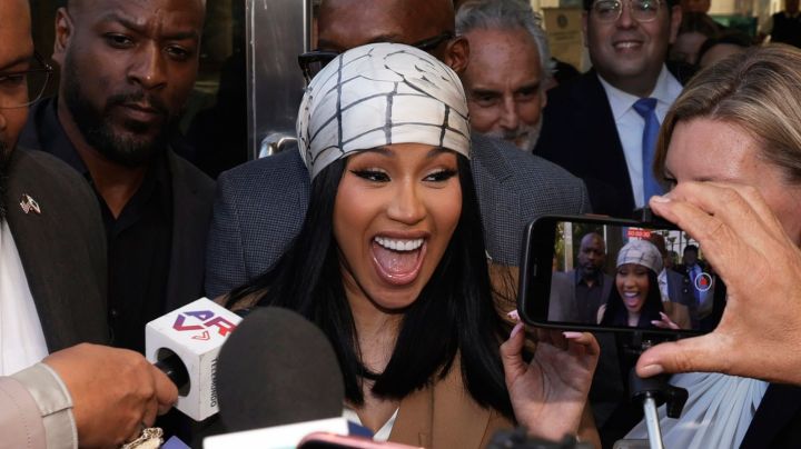 SANTA ANA, CALIFORNIA - OCTOBER 21: Cardi B is greeted by fans while departing the Ronald Reagan Federal Building and U.S. Courthouse on October 21, 2022 in Santa Ana, California. A jury ruled in Cardi B's favor after she was sued for copyright infringement for allegedly using an image of a man's tattoo on a mixtape cover. (Photo by Frazer Harrison/Getty Images)