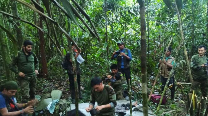 JUNGLE, COLOMBIA - JUNE 9: (----EDITORIAL USE ONLY - MANDATORY CREDIT - 'COLOMBIAN MILITARY FORCES / HANDOUT' - NO MARKETING NO ADVERTISING CAMPAIGNS - DISTRIBUTED AS A SERVICE TO CLIENTS----) Colombian Military Forces help four children who survived 40 days in the Amazon jungle after their plane crashed in the department of Caqueta on June 9, 2023. A miracle in the jungle is how Colombians are describing the discovery Friday of four indigenous children who survived 40 days in the Amazon jungle after their plane crashed. The children were flying May 1 from Araracuara, in Amazonas province, to San Jose del Guaviare, in southeastern Colombia when the plane malfunctioned and crashed. Three adults, including the children's mother, died. (Photo by Colombian Military Forces / Handout/Anadolu Agency via Getty Images)