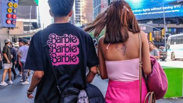 NEW YORK, NEW YORK - JULY 21: People dress up as the doll Barbie to attend the Barbie movie on July 21, 2023 in New York City. On the opening day, director Greta Gerwig's film "Barbie" sparked a Barbie-mania among fans who flocked to the theaters wearing their favorite Barbie-inspired attire. (Photo by Stephanie Keith/Getty Images)