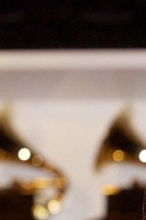 Quarters_Celia Cruz holds her GRAMMY for Best Traditional Tropical Album. (Photo by SGranitz/WireImage)