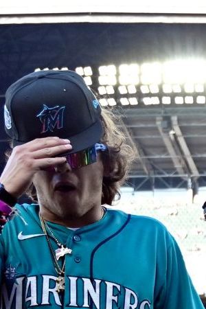 SEATTLE, WA - JULY 08: Marcello Hernandez #23, Yandel #150 and Natti Natasha #1 of Team Finch dance during the MLB All-Star Celebrity Softball Game presented by Corona at T-Mobile Park on Saturday, July 8, 2023 in Seattle, Washington. (Photo by Cheyenne Boone/MLB Photos via Getty Images)