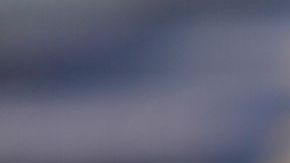 NEW YORK, NEW YORK - SEPTEMBER 14: Samia Laaboudi wears a beige long trench coat, a neon orange shiny leather handbag from Telfar, a burgundy shiny leather large handbag from Telfar, outside Michael Kors, during New York Fashion Week, on September 14, 2022 in New York City. (Photo by Edward Berthelot/Getty Images)