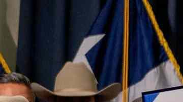 AUSTIN, TEXAS - JUNE 08: Texas Gov. Greg Abbott displays a signed bill during a news conference on June 08, 2023 in Austin, Texas. Gov. Abbott and Texas Department of Public Safety Director Steve McCraw joined bill authors, sponsors, legislators and law enforcement members in the signing of bills designated towards enhancing border security along the southern border. (Photo by Brandon Bell/Getty Images)