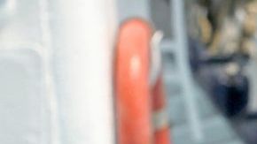Australian sailor Tim Shaddock (2nd-L) poses for a picture after arriving at the port of Manzanillo, Colima State, on July 18, 2023. An Australian sailor rescued with his dog after more than two months adrift in the Pacific Ocean arrived in Mexico Tuesday, declaring, "I am so grateful. I'm alive." Tim Shaddock was picked up with his dog "Bella" by a tuna vessel after the pair survived for weeks on raw fish and rainwater on their storm-crippled boat. (Photo by ULISES RUIZ / AFP) (Photo by ULISES RUIZ/AFP via Getty Images)