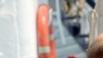 Australian sailor Tim Shaddock (2nd-L) poses for a picture after arriving at the port of Manzanillo, Colima State, on July 18, 2023. An Australian sailor rescued with his dog after more than two months adrift in the Pacific Ocean arrived in Mexico Tuesday, declaring, "I am so grateful. I'm alive." Tim Shaddock was picked up with his dog "Bella" by a tuna vessel after the pair survived for weeks on raw fish and rainwater on their storm-crippled boat. (Photo by ULISES RUIZ / AFP) (Photo by ULISES RUIZ/AFP via Getty Images)