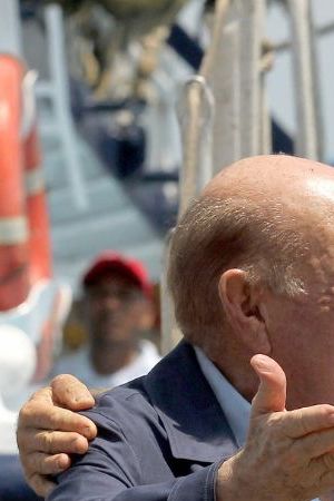 Australian sailor Tim Shaddock (2nd-L) poses for a picture after arriving at the port of Manzanillo, Colima State, on July 18, 2023. An Australian sailor rescued with his dog after more than two months adrift in the Pacific Ocean arrived in Mexico Tuesday, declaring, "I am so grateful. I'm alive." Tim Shaddock was picked up with his dog "Bella" by a tuna vessel after the pair survived for weeks on raw fish and rainwater on their storm-crippled boat. (Photo by ULISES RUIZ / AFP) (Photo by ULISES RUIZ/AFP via Getty Images)
