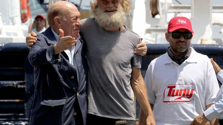 Australian sailor Tim Shaddock (2nd-L) poses for a picture after arriving at the port of Manzanillo, Colima State, on July 18, 2023. An Australian sailor rescued with his dog after more than two months adrift in the Pacific Ocean arrived in Mexico Tuesday, declaring, "I am so grateful. I'm alive." Tim Shaddock was picked up with his dog "Bella" by a tuna vessel after the pair survived for weeks on raw fish and rainwater on their storm-crippled boat. (Photo by ULISES RUIZ / AFP) (Photo by ULISES RUIZ/AFP via Getty Images)