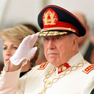 SANTIAGO, CHILE: General Augusto Pinochet salutes during a military parade in honor of his retirement as commander of the Chilean Army 06 March in Santiago. Pinochet was awarded the title of Meritorious Commander of the Army for Life. AFP PHOTO CRIS BOURONCLE (Photo credit should read CRIS BOURONCLE/AFP via Getty Images)