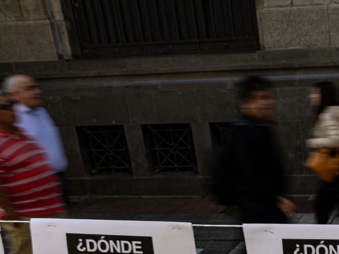 Pictures of women who disappeared and were politically executed during Augusto Pinochet's dictatorship (19731990) hang in a memorial installed by the Chilean Network against Violence against Women, in downtown Santiago on August 3, 2023. September 11 marks the 50th anniversary of the coup d'état led by General Augusto Pinochet that overthrew Chilean President Salvador Allende. (Photo by MARTIN BERNETTI / AFP) (Photo by MARTIN BERNETTI/AFP via Getty Images)