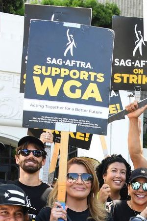 CULVER CITY, CALIFORNIA - AUGUST 04: Members of Latinas Acting Up pose for a photo while SAG-AFTRA and WGA walk the picket line at Sony Studios on August 04, 2023 in Culver City, California. Members of SAG-AFTRA and WGA (Writers Guild of America) have both walked out in their first joint strike against the studios since 1960. The strike has shut down a majority of Hollywood productions with writers in the third month of their strike against the Hollywood studios. (Photo by Albert L. Ortega/Getty Images)